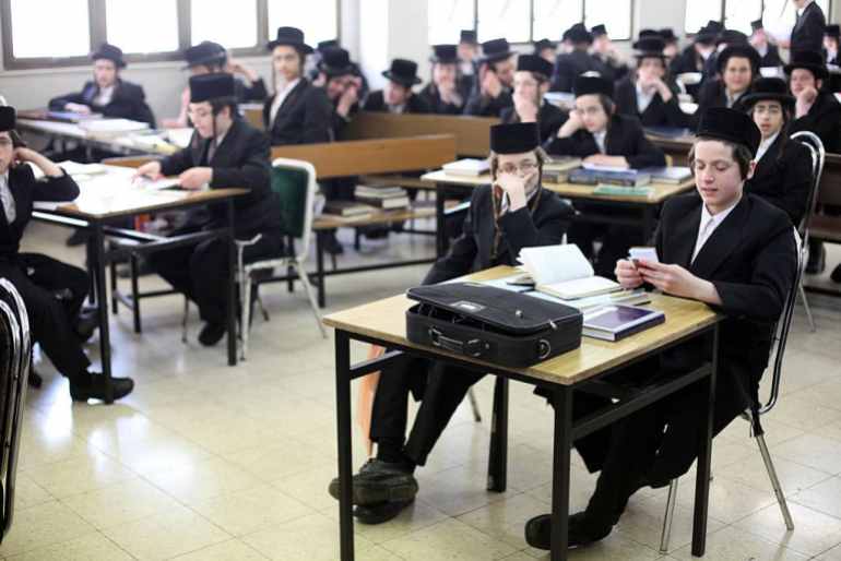 Ultra Orthodox Jewish children study in Belz synagogue on April 14, 2011 in Jerusalem, Israel. (Photo by Lior Mizrahi/Getty Images)