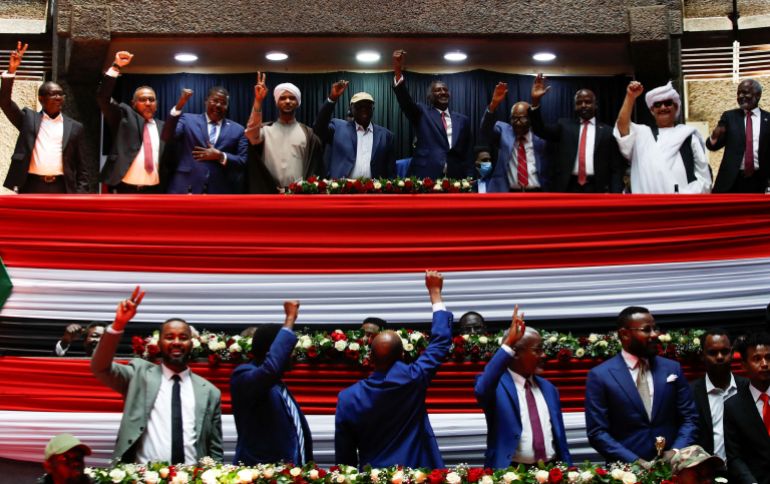 Delegates affiliated to Sudan's Rapid Support Forces (RSF) react during a meeting in Nairobi