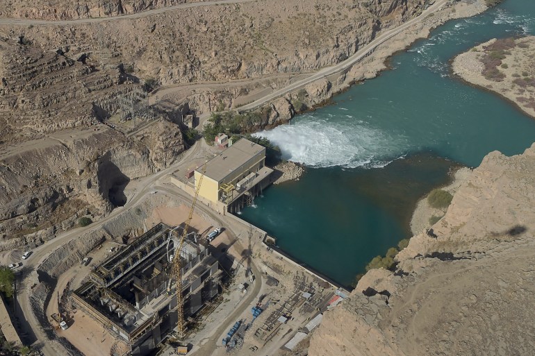 In this photograph taken on March 21, 2021, a general view of the hydroelectric Kajaki Dam is seen in Kajaki, northeast of Helmand Province. In the heart of territory under siege from the Taliban, one of Afghanistan's most important hydroelectric dams is at the centre of a power struggle that symbolises the battle between the government and insurgents. (Photo by WAKIL KOHSAR / AFP) / TO GO WITH Afghanistan-environment-dam-Taliban,FOCUS by Elise BLANCHARD