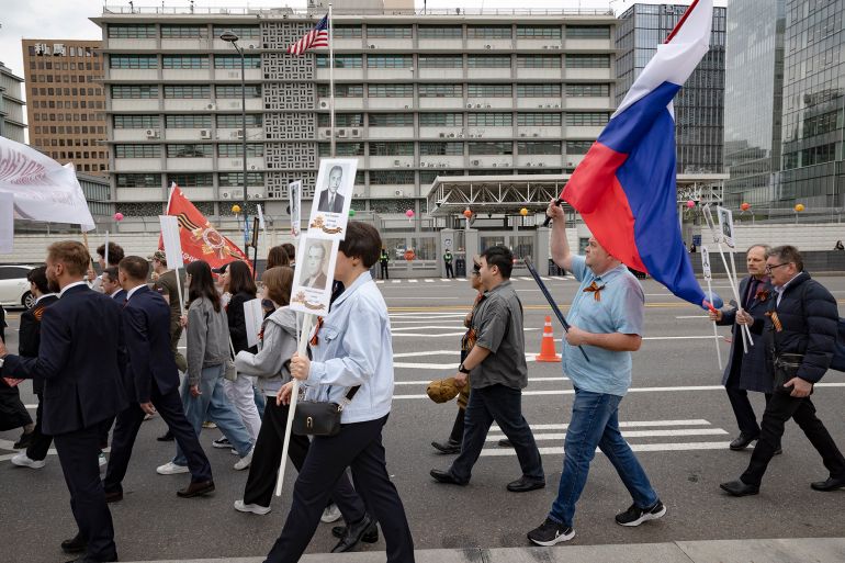 بالصور.. روسيا وأوروبا تحييان ذكرى الانتصار على النازية 10 Over 200 members of the Coordinating Council of Russian Compatriot Organizations and other Russian residents in South Korea march in a Victory Day parade in front of the U.S. Embassy in Seoul, South Korea, on May 6, 2025. (Photo by Chris Jung/NurPhoto via Getty Images)