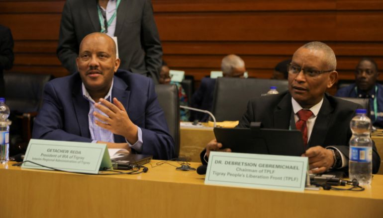 ماذا يعني نزع القانونية عن جبهة تحرير تيغراي؟ 2 Getachew Reda, President of the Interim Regional Administration of Tigray and Debretsion Gebremichael, Chairman of Tigray People's Liberation Front (TPLF) attend the launch of the report on the Pretoria peace agreement during the 38th Ordinary Session of the Assembly of the Heads of State and Government of the African Union (AU) at the headquarters in Addis Ababa, Ethiopia, February 16, 2025. REUTERS/Tiksa Negeri