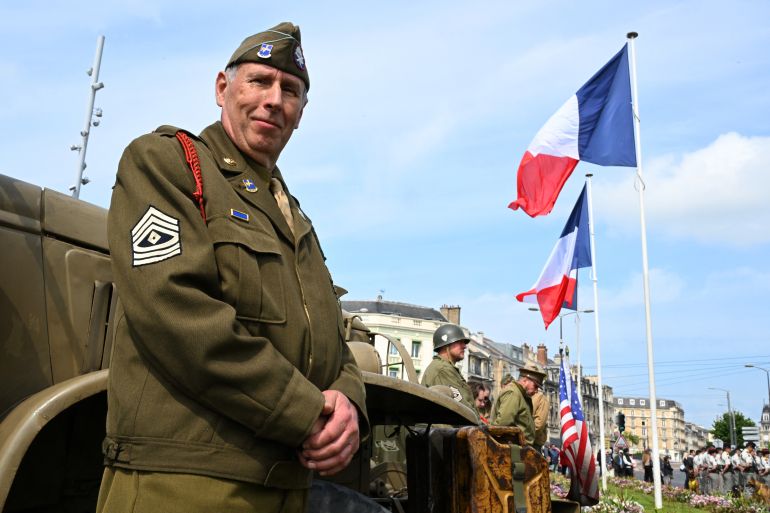بالصور.. روسيا وأوروبا تحييان ذكرى الانتصار على النازية 16 A reenactor dressed in a US paratrooper WWII uniform takes part in the Commemoration of the 80th anniversary of the end of World War II in Europe, in Reims, north eastern France, where Nazi Germany signed its initial 1945 surrender, on May 7, 2025.