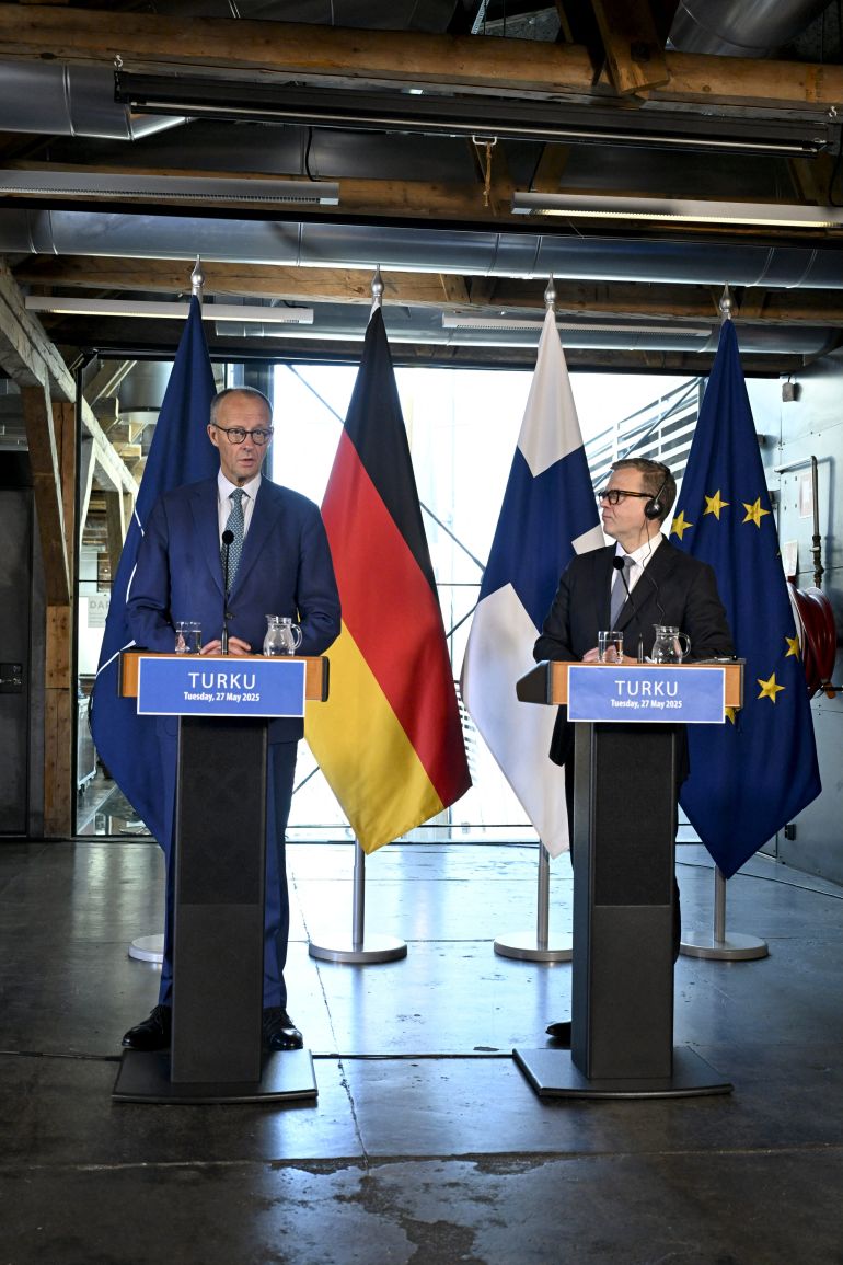 ترامب: بوتين يلعب بالنار 1 German Chancellor Friedrich Merz (L) and Finnish Prime Minister Petteri Orpo give a joint press conference during the Nordic Prime Ministers' Summer Meeting in Turku, Finland, on May 27, 2025. (Photo by Roni Rekomaa / LEHTIKUVA / AFP) / FINLAND OUT