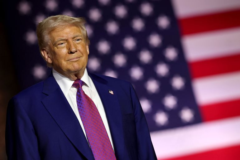 قلق إسرائيلي وتطمينات أميركية بشأن قرب الاتفاق حول نووي إيران 1 DOHA, QATAR - MAY 15: U.S. President Donald J. Trump stands on stage as he tours the Al Udeid Air Base on May 15, 2025, in Doha, Qatar. Trump is on the third day of his visit to the Gulf to underscore the strategic partnership between the United States and Qatar, focusing on regional security and economic collaboration. (Photo by Win McNamee/Getty Images)
