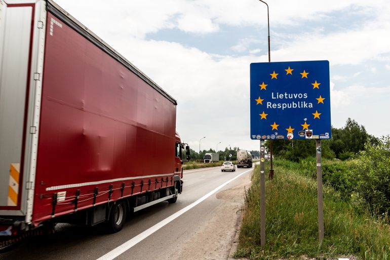 شبح "الرجال الخضر الصغار" يخيم على دول البلطيق 1 A lorry with goods passes the Lithuanian border sign to enter Lithuania on June 29, 2022 at Polish-Lituanian border on the busy E67 road. The Polish border with Lithuania is situated between Kaliningrad oblast (part of Russia) and Belarus and stretches 100 kilometers. The Area is called Suwalki Gap and is the only connection between Baltic States and the rest of the NATO and European Union. After Lithuania refused to transport sanctioned goods via rail from Russia's mainland to Kaliningrad, Vladimir Putin, Russian president, threatened Lithuania with serious consequences. Both NATO and European Union worry that Suwalki Gap, a relatively narrow corridor with Baltic States can be attacked by Russia
