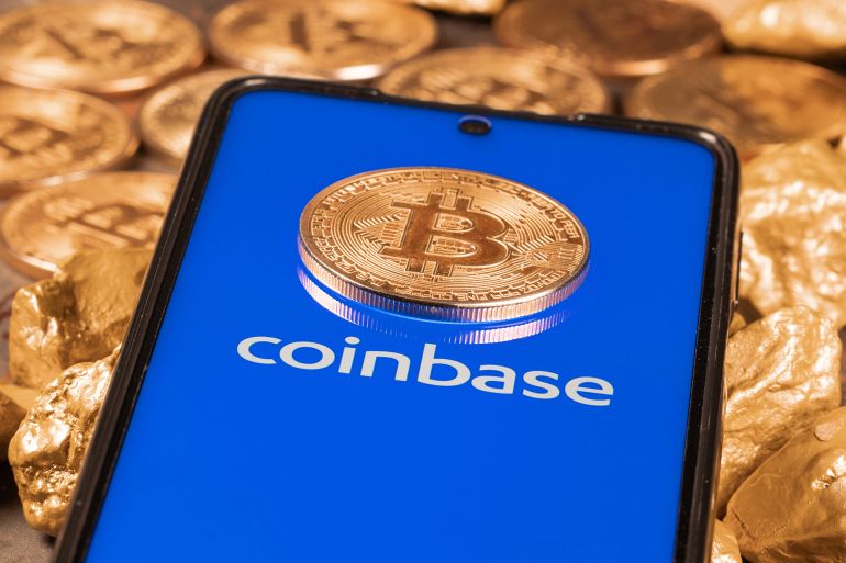 هجوم إلكتروني يهز عرش "كوين بيس".. مخترقون يساومون على ملايين العملات 1 Coinbase crypto exchange logo on screen with Bitcoin coins. Ljubljana, Slovenia - April 12 2021; Shutterstock ID 1954704901; purchase_order: aj; job: ; client: ; other: