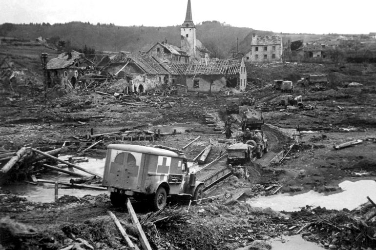 بالصور.. كيف محَت الحرب العالمية الثانية خرائط اليابان وأوروبا؟ 4 View of a US Army Red Cross ambulance threading its way over a makeshift bridge, and across the wreckage and devastation of the city of Lunebach, Germany, March 1945. (Photo by Office of War Information/Interim Archives/Getty Images)