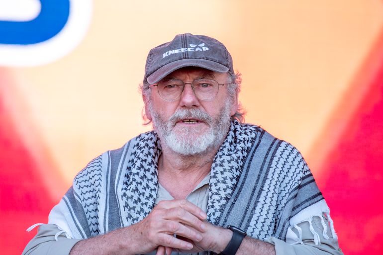يسرائيل هيوم: هؤلاء الناشطون في أسطول غزة الجديد مناهضون لإسرائيل 1 CATANIA, ITALY - MAY 31: Liam Cunningham, actor and activist, during his public speech, wearing a Palestinian keffiyeh and a cap, he appears thoughtful and intense, reflecting his commitment and solidarity with the cause he advocates for on May 31, 2025 in Catania, Italy. Swedish activist Greta Thunberg is among those who will attempt to sail to Gaza on a boat organized by the Freedom Flotilla Coalition (FFC), in a bid to break Israel's blockade of the Palestinian territory. Freedom Flotilla had to abort a previous journey in early May after it said its boat came under attack by drones in international waters near Malta. (Photo by Fabrizio Villa/Getty Images)