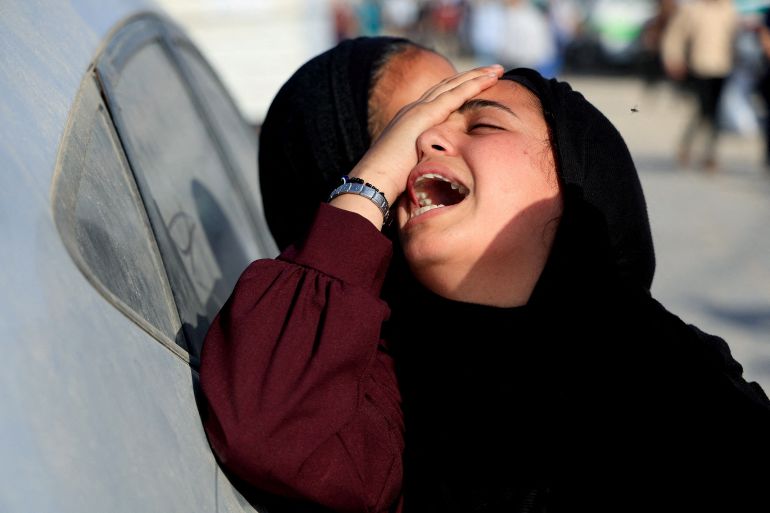 بالصور.. مساعدات غزة طرود مخضبة بالدماء 10 A mourner reacts during the funeral of Palestinians killed in Israeli strikes, at Nasser hospital, in Khan Younis, in the southern Gaza Strip, June 1, 2025. REUTERS/Hatem Khaled TPX IMAGES OF THE DAY